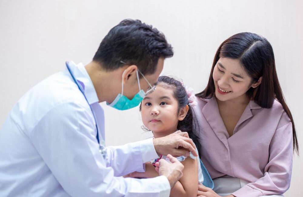 A doctor is checking a child